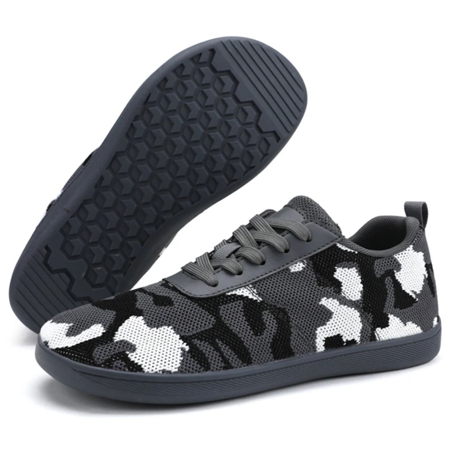 Black knit sneaker with navy rubber sole shown in angled side and bottom view.