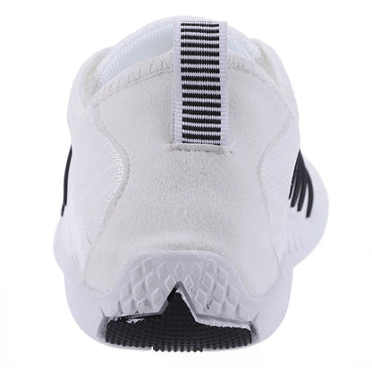 Rear view of white barefoot shoe with black vertical heel tab and low ankle cut.