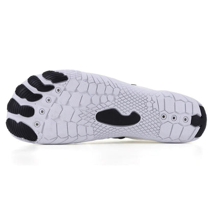 White barefoot shoe shown from side and outsole view against white background.