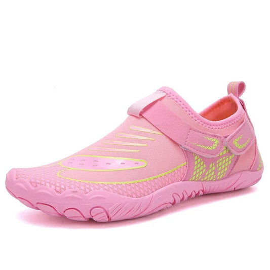 Pink water shoe with yellow accents and velcro strap, shown from side angle.