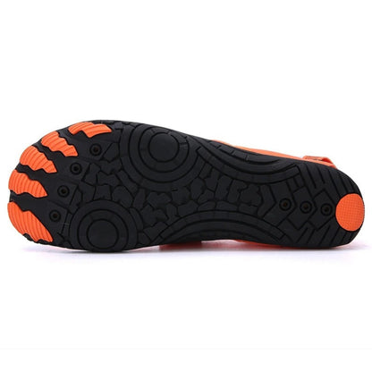 Black water shoe sole with orange grip pattern, bottom view.