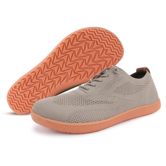 Taupe knit sneaker with orange sole, shown with side and sole view stacked.