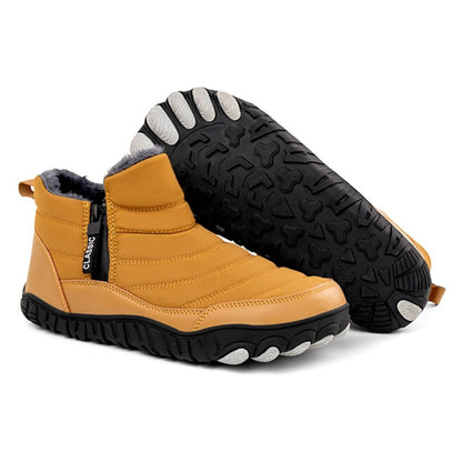 Yellow winter boot with side zip and black treaded sole, shown in angled view.