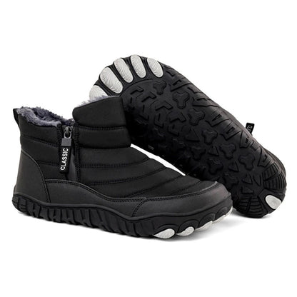 Black winter ankle boot with thick sole and side zipper, angled for sole visibility.