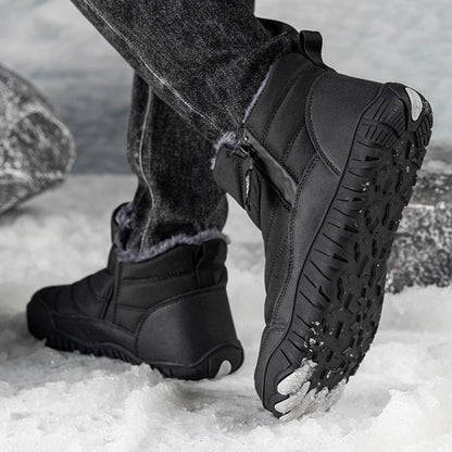 Person wearing black ankle boots with thick traction sole, walking in snowy setting.