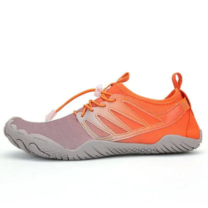 Orange water shoe with gray sole and breathable upper, shown from the side.