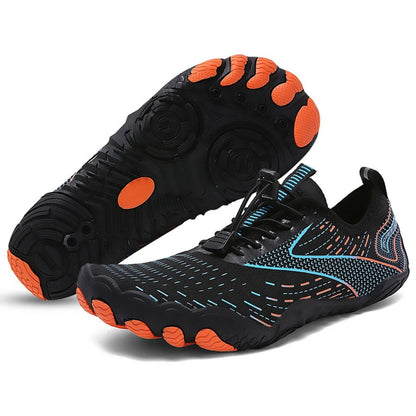 Black barefoot water shoe with orange and blue grip accents, side and sole view.