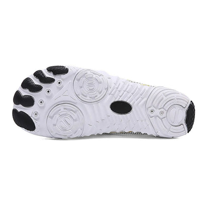 White barefoot shoe displayed from side and outsole against white background.