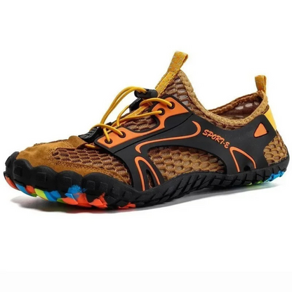 Orange and black water shoe with honeycomb mesh and multicolor sole, angled view.