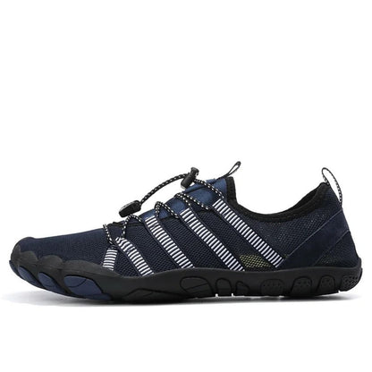 Navy water shoe with white stripes and black sole, shown in side profile.